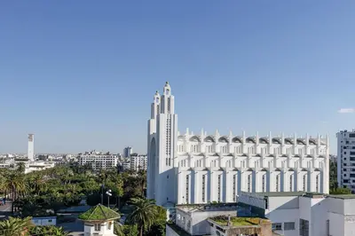 a large white building in the middle of a city at JM Suites Hotel Eco-Friendly Casablanca in Casablanca