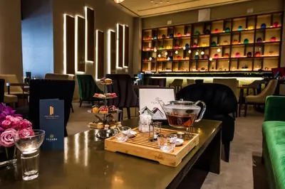 a table in a restaurant with a tray of food at Kenzi Tower Hotel in Casablanca