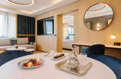 a room with a table with a bowl of fruit on it at Royal Hideaway Casablanca in Casablanca