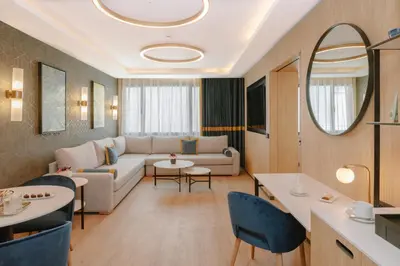 a living room with a couch and a table at Royal Hideaway Casablanca in Casablanca