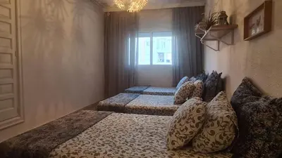 a bedroom with two beds and a window at Océan Beach in Tamaris