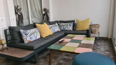 a living room with a couch and a table at Océan Beach in Tamaris