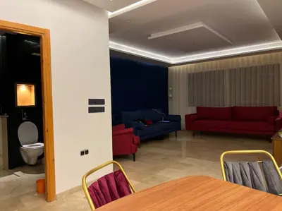 a living room with a couch and a table at offering a fantastic Apartment in Casablanca