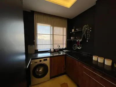 a kitchen with a washing machine in a kitchen at offering a fantastic Apartment in Casablanca