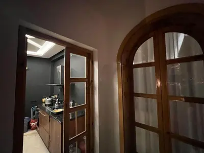 a room with a door and a kitchen with a counter at offering a fantastic Apartment in Casablanca