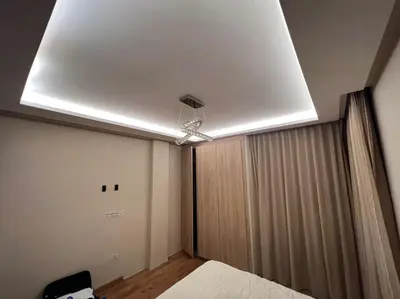 a bedroom with a ceiling fan and a bed at offering a fantastic Apartment in Casablanca
