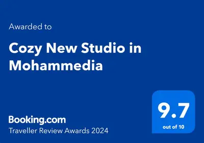 a blue sign with the words cozy new studio in mochamomica at Cozy New Studio in Mohammedia in Mohammedia