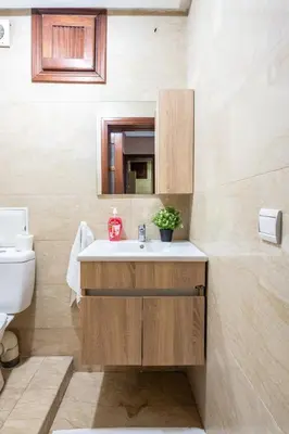 a bathroom with a sink and a toilet at Arribat Center Mall- TT Holidays Agdal in Rabat
