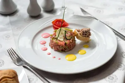 a white plate with a piece of food on it at Hotel Toubkal in Casablanca