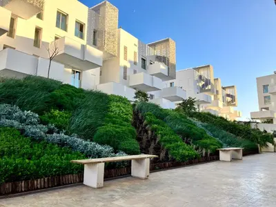 a park bench in front of a building at Casablanca Appartement haut standing CFC in Casablanca