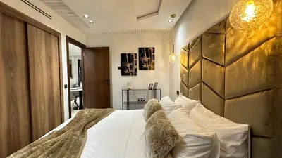 a bed with two teddy bears sitting on top of it at Charming and Central 2 Bedrooms - By AppartAli in Casablanca