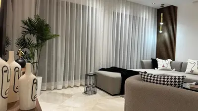a living room with a couch and a table at Charming and Central 2 Bedrooms - By AppartAli in Casablanca