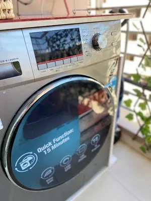 a washing machine with a sign on the door at Architects Haven in Luxury 3BR - Near Train & Tramway in Casablanca