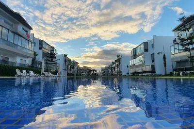 a large pool of water in front of some buildings at BLANCA BEACH Sidi Rahal Front Mer in Sidi Rahal