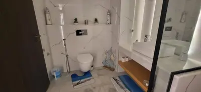 a bathroom with a toilet and a sink at L'Amouage Casablanca Location Journalière Casablanca in Casablanca